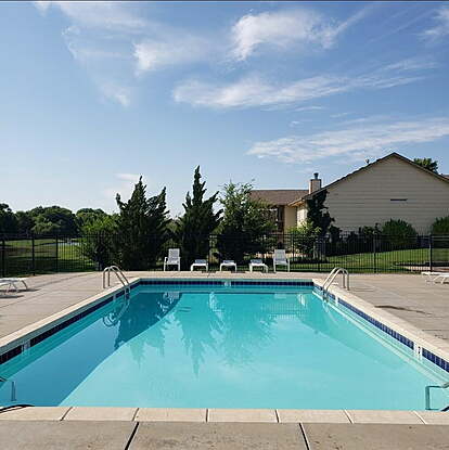 Clean pool with chairs around the edges